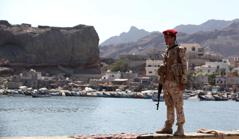 A soldier allied to Yemen's internationally recognized government stands guard at the fish market in Aden, Yemen, Thursday, Dec. 13, 2018. A sense of normalcy has returned to Aden, now the seat of power for Yemenâs internationally recognized government, but many challenges remain for bringing a lasting peace to the Arab worldâs poorest country.