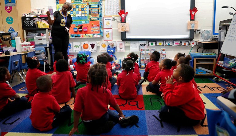 In this Tuesday, Dec. 18, 2018 photo, Michelle Garnett teaches a pre-kindergarten class at Alice M. Harte Charter School in New Orleans. Charter schools, which are publicly funded and privately operated, are often located in urban areas with large back populations, intended as alternatives to struggling city schools. 