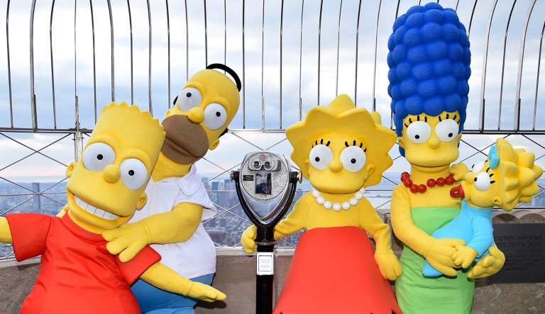 Several costumed characters from "The Simpsons" are pictured: from left, Bart Simpson, Homer Simpson, Lisa Simpson, Marge Simpson, and Maggie Simpson.