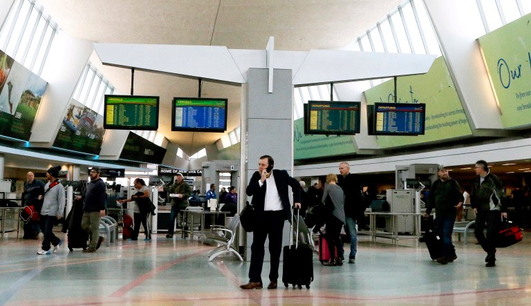 Travelers walk through the terminal at the Buffalo Niagara International Airport on Monday, Dec. 10, 2018, in Buffalo, N.Y. 