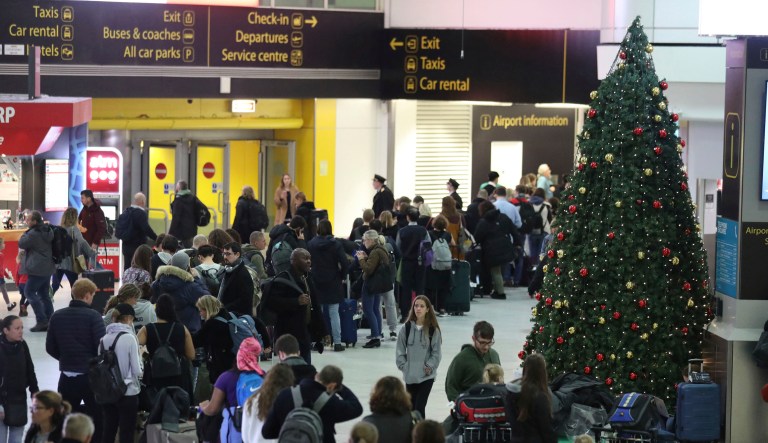 Passengers at Gatwick airport wait for their flights following the delays and cancellations brought on by drone sightings near the airfield, in London, Friday Dec. 21, 2018. New drone sightings Friday caused fresh chaos for holiday travelers at London's Gatwick Airport.
