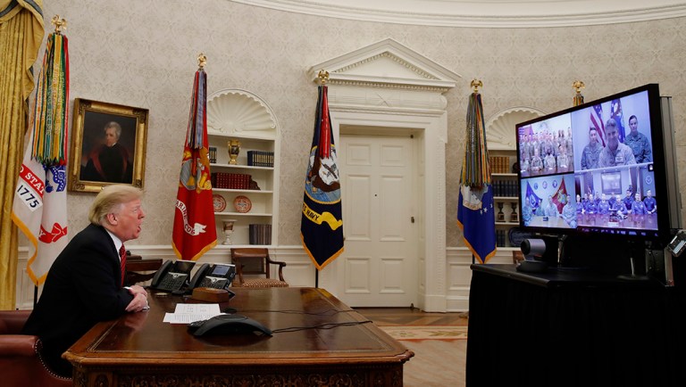 President Trump greets members of the five branches of the military via video conference on Christmas Day.