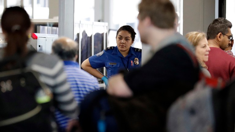 A TSA worker works at O'Hare International Airport in Chicago.