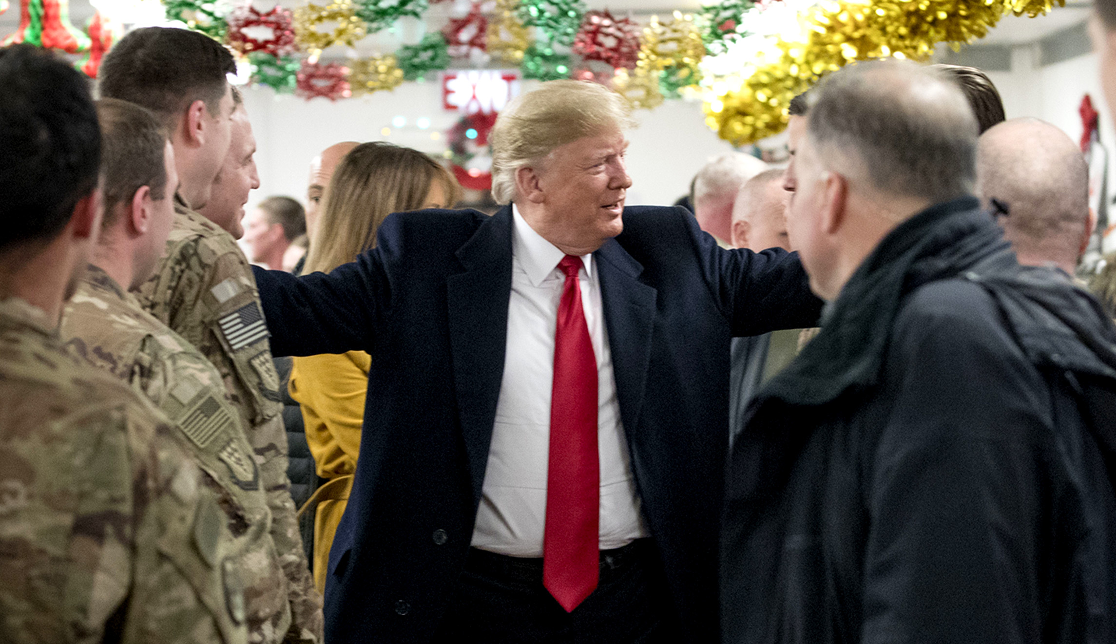 Trump makes surprise trip to Iraq to visit with troops, says US intends to stay