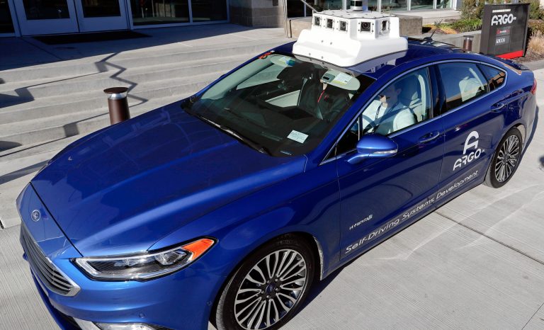 In this Dec. 18, 2018, photo a sensor and camera array on top of one of the test vehicles from Argo AI, Ford's autonomous vehicle unit, is parked at the company offices in Pittsburgh.