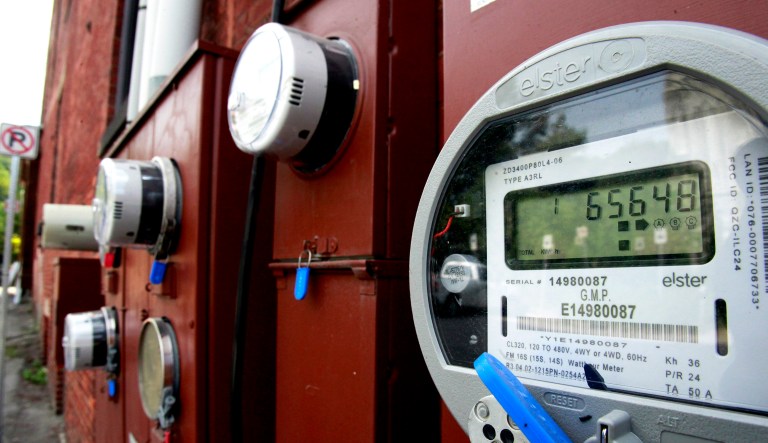 Electric meters are seen on a building.