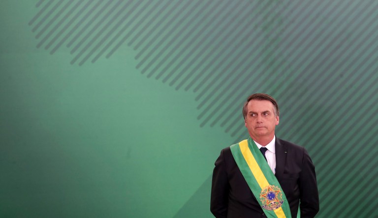 Brazil's President Jair Bolsonaro looks on as he presents his cabinet at the Planalto Presidential palace, in Brasilia, Brazil, Tuesday, January 1, 2019.