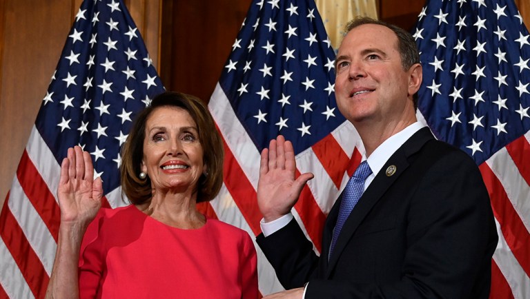 House Speaker Nancy Pelosi, D-Calif., left, poses during a ceremonial swearing-in with Rep. Adam Schiff, D-Calif., right, on Capitol Hill.