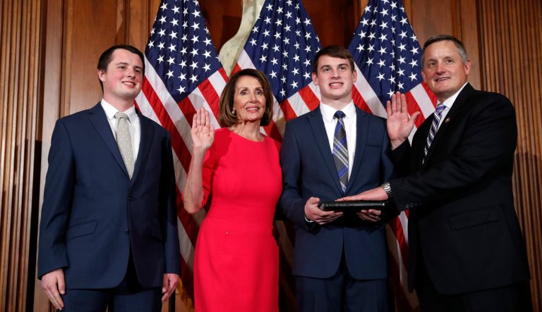 House Speaker Nancy Pelosi of Calif., left, poses during a ceremonial swearing-in with Rep. Bruce Westerman, R-Ark., right, on Capitol Hill, Thursday, Jan. 3, 2019 in Washington during the opening session of the 116th Congress.
