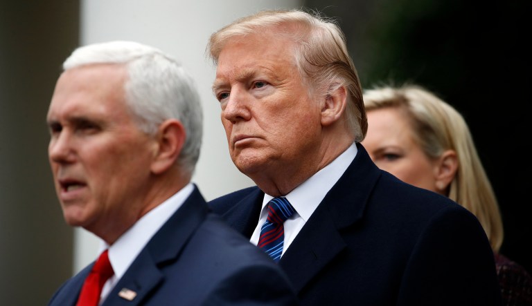 President Trump listens as Vice President Mike Pence speaks in the Rose Garden of the White House after a meeting with Congressional leaders on border security, Friday, Jan. 4, 2019, at the White House in Washington, as Homeland Security Secretary Kirstjen Nielsen listens at right.