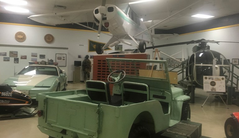 In this Nov. 29, 2018 photo, a vintage U.S. Border Patrol vehicle sits in a museum for the border patrol in El Paso, Texas. The U.S. Border Patrol Museum explores the story from the agency's formation to fight Chinese immigration and Prohibition, to its role amid massive migration and cartel drug smuggling.