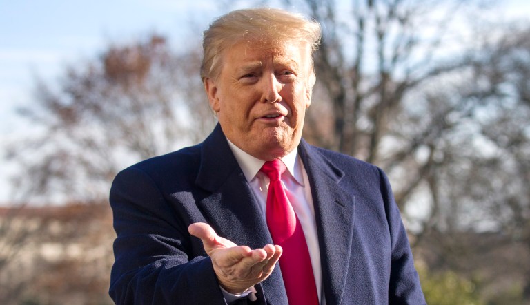 President Trump speaks on the South Lawn of the White House as he walks from Marine One on Sunday in D.C.