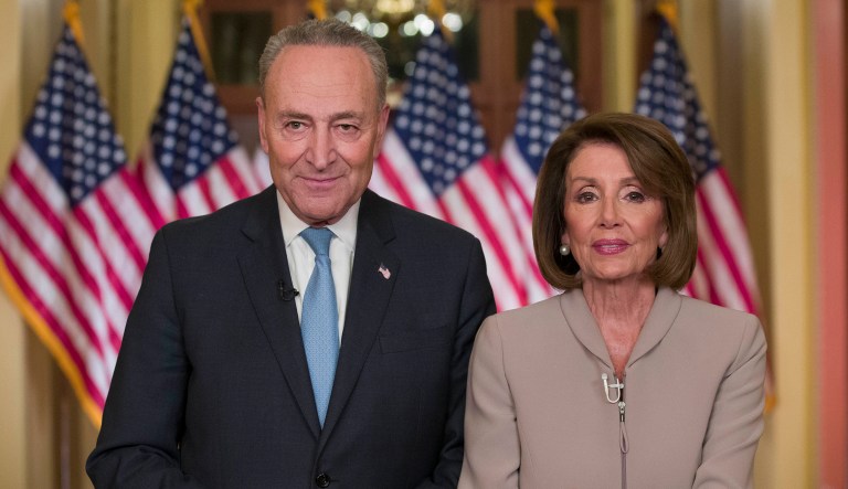 Senate Minority Leader Chuck Schumer of N.Y., and House Speaker Nancy Pelosi of Calif., pose for photographers after speaking on Capitol Hill in Washington.