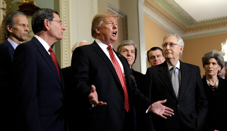 President Trump speaks after attending a Senate Republican policy lunch on Capitol Hill, Wednesday, Jan. 9, 2018, in Washington, as from left, Sen. John Thune, R-S.D., Sen. John Barrasso, R-Wyo., Sen. Roy Blunt, R-Mo., Sen. Todd Young, R-Ind., Senate Majority Leader Mitch McConnell of Ky., and Sen. Joni Ernst, R-Iowa, listen. 