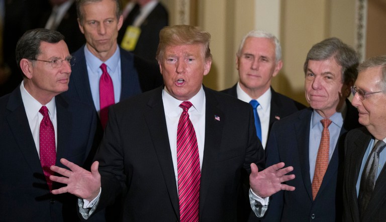 Sen. John Barrasso, R-Wyo., left, and Sen. John Thune, R-S.D., stand with President Trump, Vice President Mike Pence, Sen. Roy Blunt, R-Mo., and Senate Majority Leader Mitch McConnell of Kentucky, as Trump speaks while departing after a Senate Republican policy luncheon, on Capitol Hill in Washington, Wednesday, Jan. 9, 2019. 