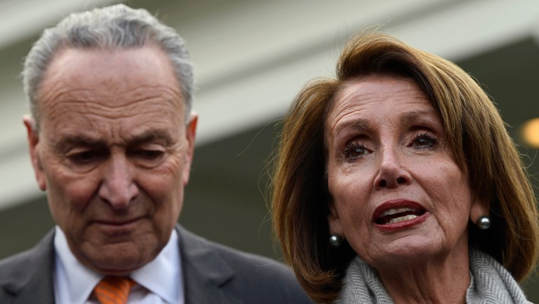 House Speaker Nancy Pelosi, D-Calif., right, speaks as she stands next to Senate Minority Leader Sen. Chuck Schumer, D-N.Y., left, following their meeting.