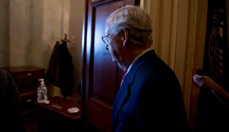Senate Majority Leader Mitch McConnell of Kentucky walks into his office for a meeting with Senate Republicans on Capitol Hill in Washington, Thursday, Jan. 10, 2019.