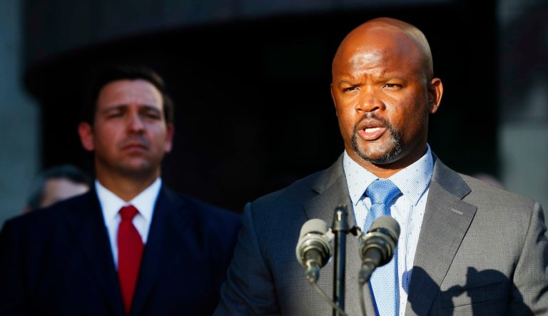 Sheriff Gregory Tony, right, speaks after being introduced by Florida Gov. Ron DeSantis, left, at the Broward County Sheriff's Office Fort Lauderdale headquarters, Friday, Jan. 11, 2019, in Fort Lauderdale, Fla.