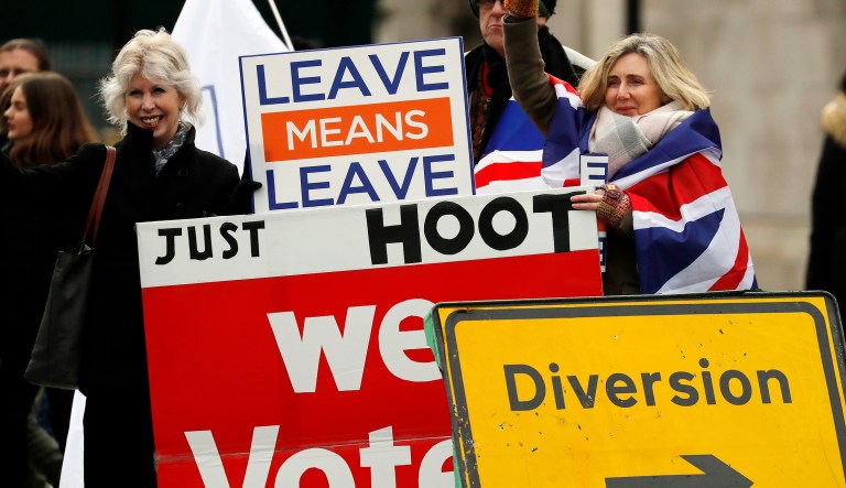 Leavers display banners opposite the Houses of Parliament to protest against the Brexit deal in London.