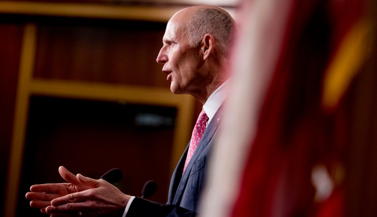 Sen. Rick Scott, R-Fla., talks to the media.