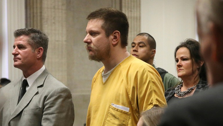 Former Chicago police Officer Jason Van Dyke and his attorney Daniel Herbert listen during Van Dyke's sentencing hearing.