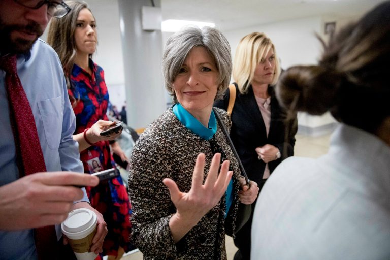 Sen. Joni Ernst, R-Iowa, reacts to a reporter's question as she arrives at the U.S. Capitol building on Capitol Hill on Jan. 24. 