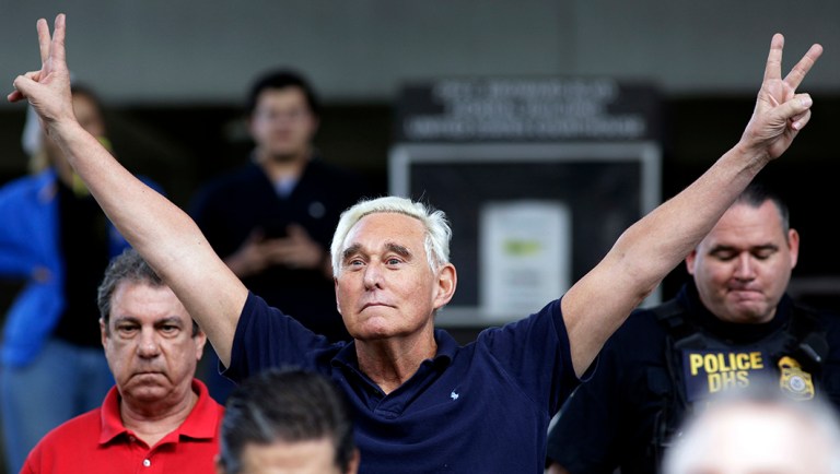 Roger Stone walks out of the federal courthouse following a hearing.