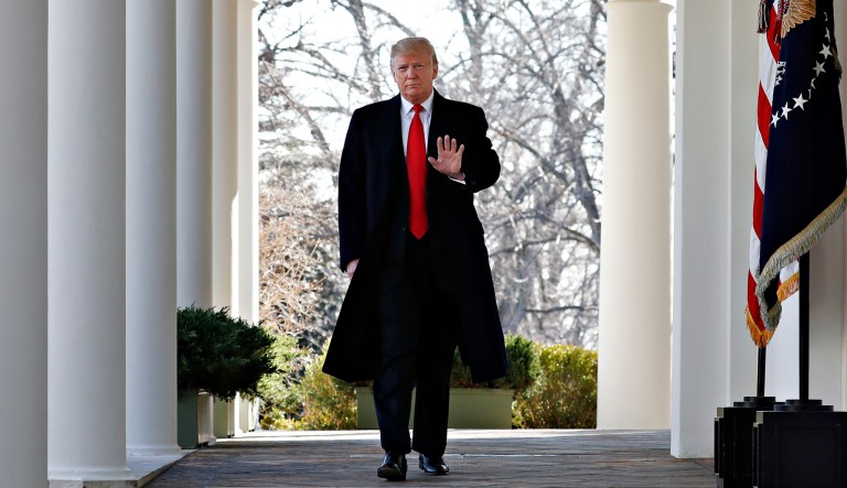 President Trump walks through the White House.