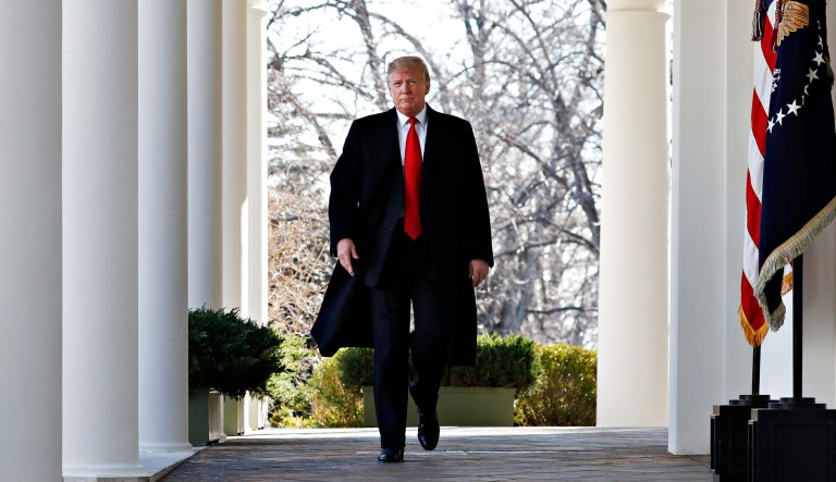 President Trump walks outside the White House.