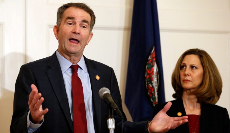 Virginia Gov. Ralph Northam, left, gestures as his wife, Pam, listens during a press conference in the Governors Mansion at the Capitol in Richmond, Va., Saturday, Feb. 2, 2019. Northam is under fire for a racial photo the appeared in his college yearbook.