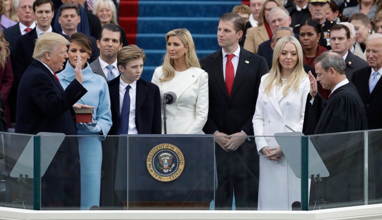 n this Jan. 20, 2017 file photo, Donald Trump, left, is sworn in as the 45th president of the United States by Chief Justice John Roberts.