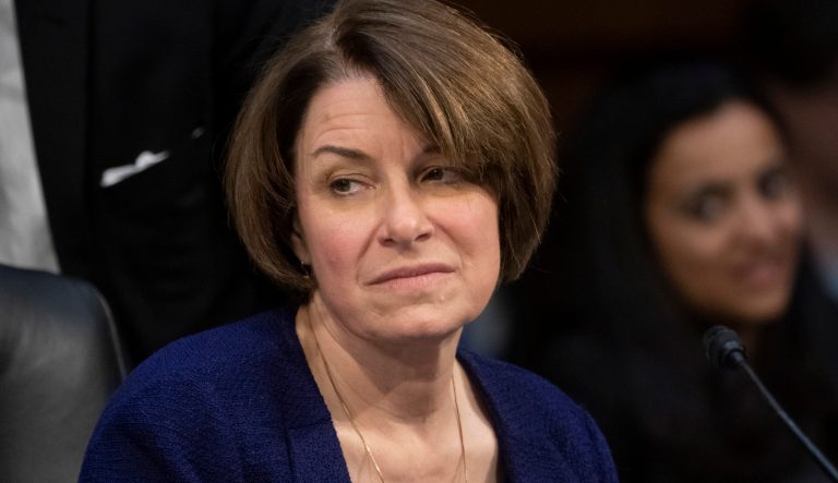 Senate Judiciary Committee member Sen. Amy Klobuchar, D-Minn., prepares to vote against advancing William Barr's nomination for attorney general, as the panel meets on Capitol Hill in Washington, Thursday, Feb. 7, 2019.