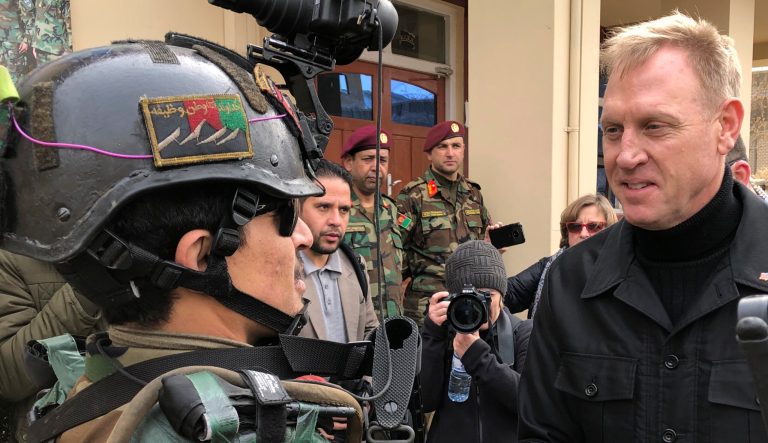 Acting Secretary of Defense Pat Shanahan greets an Afghan commando at Camp Commando, Afghanistan on Monday, Feb. 11, 2019.