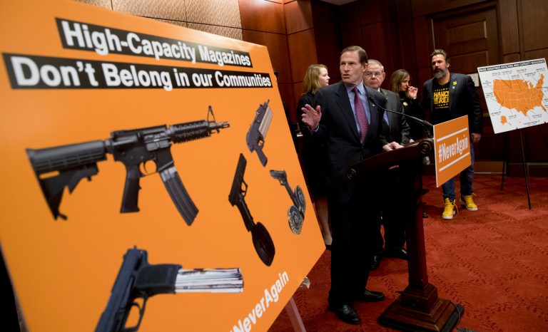 Sen. Richard Blumenthal, D-Conn., center, accompanied by Sen. Bob Menendez, D-N.J., third from right, speaks at a news conference on an proposed amendment to ban high capacity magazines in guns, on Capitol Hill, Tuesday, Feb. 12, 2019, in Washington. 