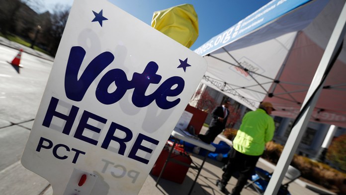 A sign directs voters to the Denver Elections Division drop off location in front of the City/County Building in Denver.