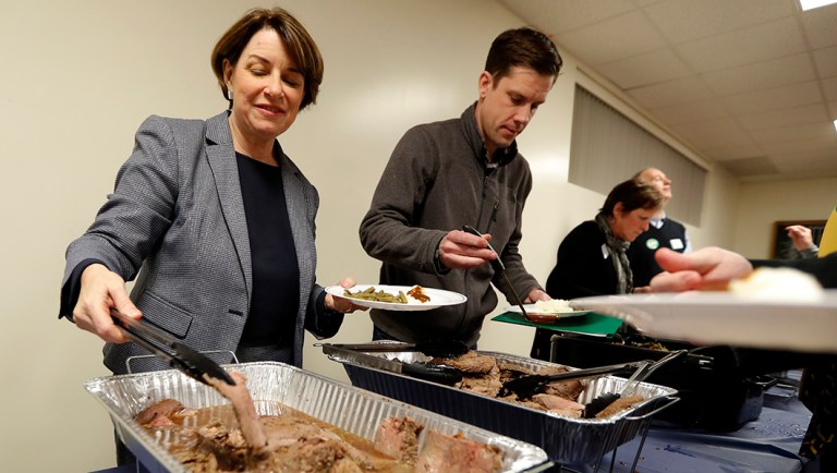 2020 Democratic presidential candidate Sen. Amy Klobuchar makes her way through the serving line.