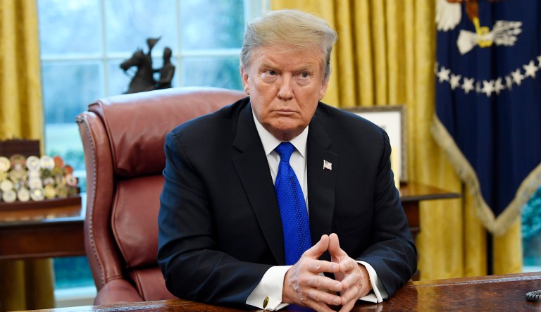 President Trump sits in the White House.