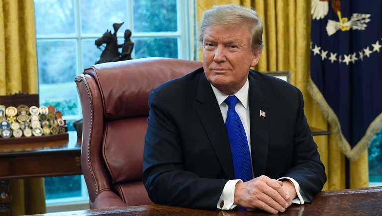 President Trump listens during his meeting.
