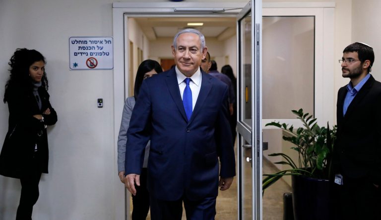 Israeli Prime Minister Benjamin Netanyahu arrives for the weekly cabinet meeting at his office in Jerusalem, Sunday, Feb. 24, 2019. 
