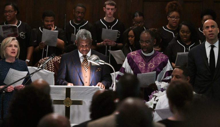 Former Secretary of State Hillary Clinton, far left, and U.S. Sen. Cory Booker, far right, D-N.J., participate in a commemorative service marking the anniversary of "Bloody Sunday"   at Brown Chapel AME Church in Selma, Ala., Sunday, March 3, 2019. 