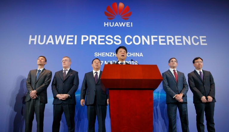 Huawei Rotating Chairman Guo Ping, center, speaks in front of other executives during a press conference in Shenzhen, China's Guangdong province, Thursday, March 7, 2019. 