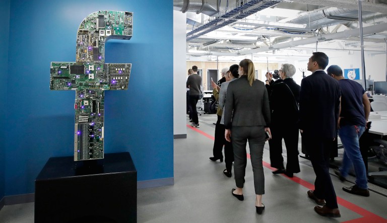 Media and guests tour Facebook's new 130,000-square-foot offices, which occupy the top three floors of a 10-story Cambridge, Mass., building.