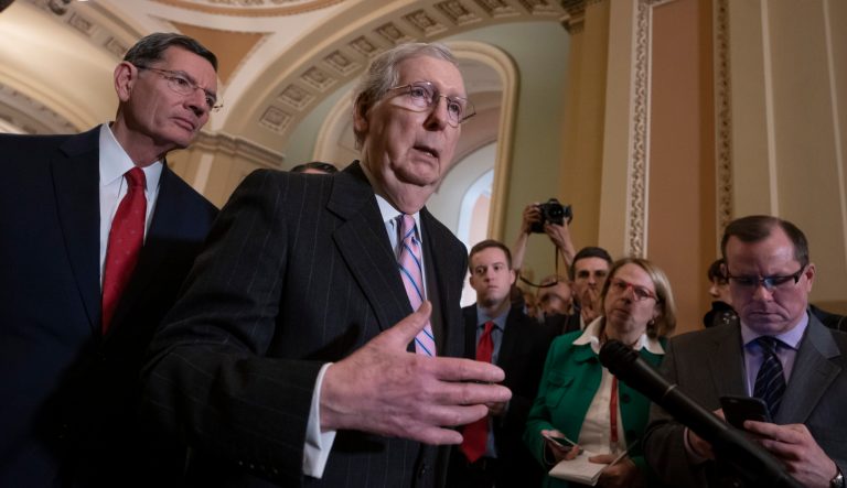 Senate Majority Leader Mitch McConnell, R-Ky., joined at left by Sen. John Barrasso, R-Wyo., speaks to reporters following a closed-door GOP policy meeting, at the Capitol in Washington, Tuesday, March 12, 2019. 