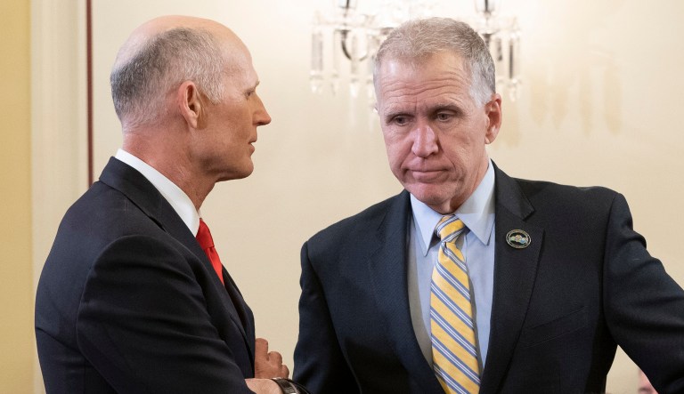 Sens. Rick Scott (left) and Thom Tillis (right) are seen. 