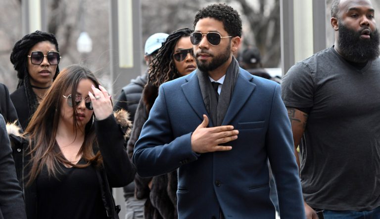 Empire actor Jussie Smollett, center, arrives at the Leighton Criminal Court Building for his hearing on Thursday, March 14, 2019, in Chicago. 