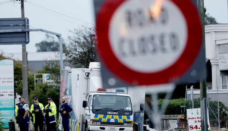 Police gather outside the Linwood mosque, site of one of the mass shootings at two mosques in Christchurch, New Zealand.