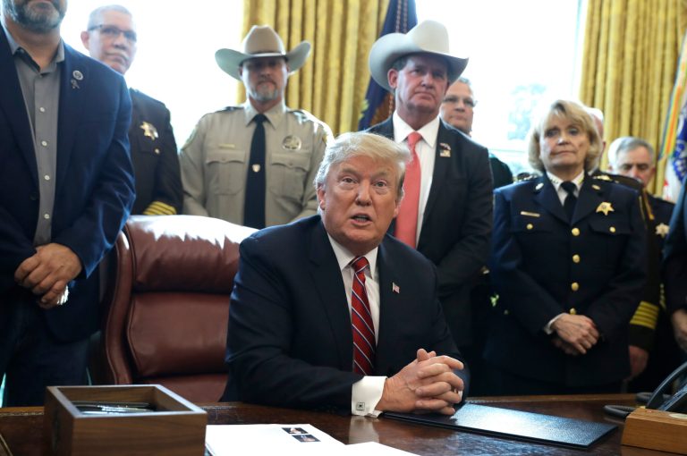In this March 15, 2019 photo, President Donald Trump speaks about border security in the Oval Office of the White House, Friday, March 15, 2019, in Washington. 