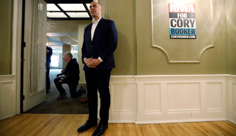 2020 Democratic presidential candidate Sen. Cory Booker waits to speak at a meeting with local residents, Saturday, March 16, 2019, in Ottumwa, Iowa. 