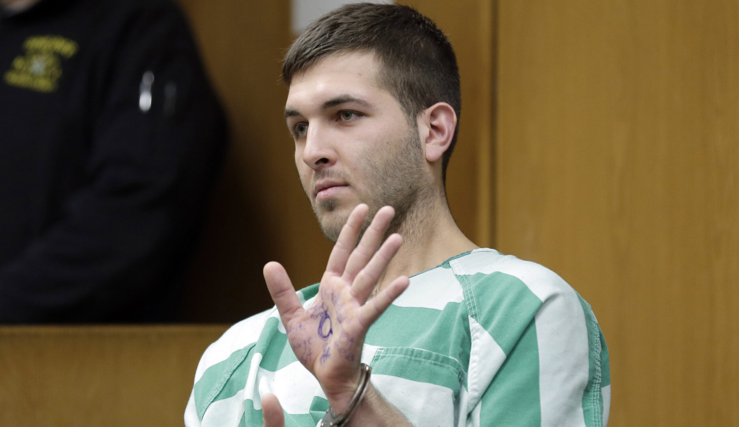 Suspect in hit on mafia boss displays Trump slogan in court