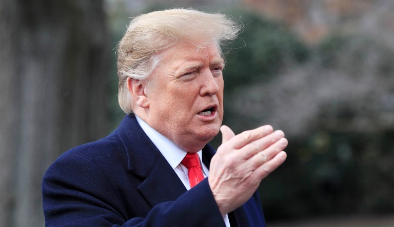 President Trump speaks to reporters before departing the White House in D.C.